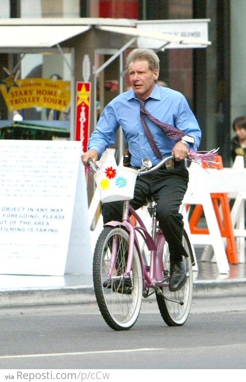 Harrison Ford Riding A Girl's Bike