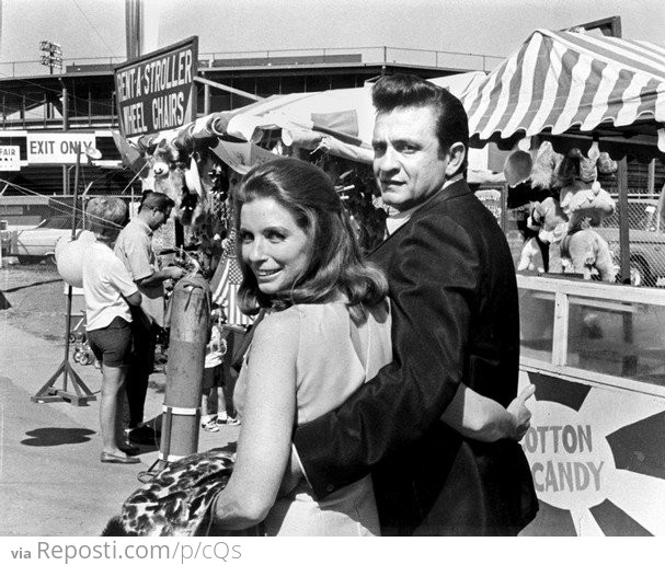Johnny Cash and June Carter Cash at a fair in 1968
