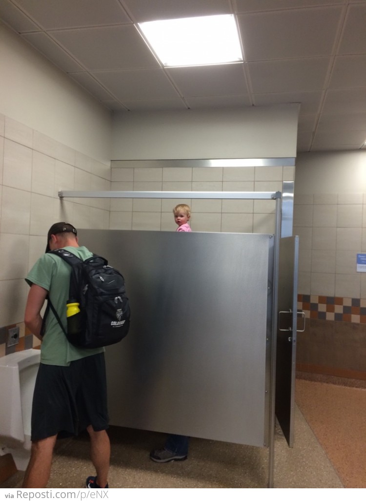 I just saw this tall guy with a really weird head in the bathroom