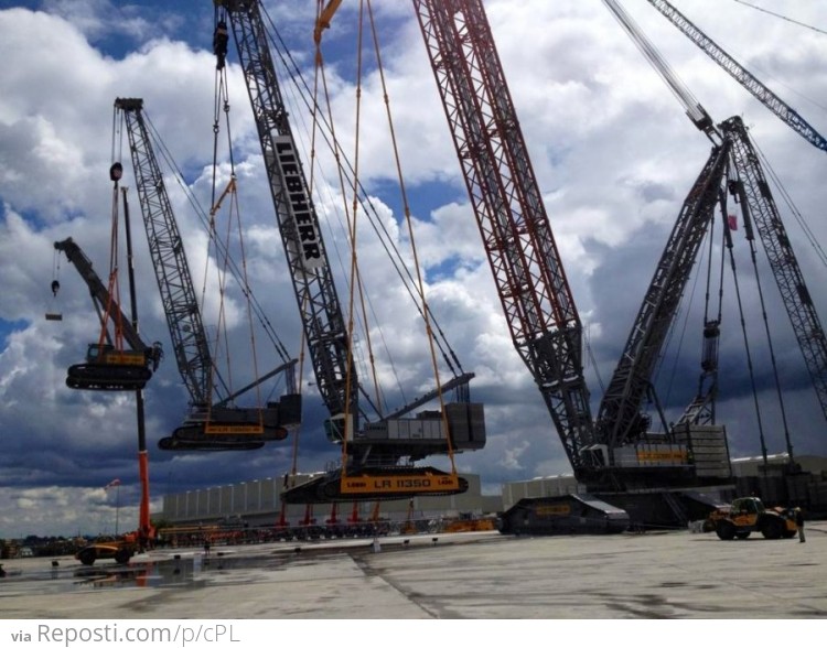 A crane lifting a crane lifting a crane lifting a crane