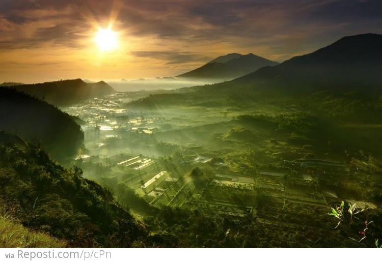 Spectacular sunrise over Batur Utara, Bali