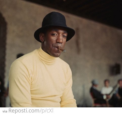 Young Bill Cosby smokin' a cigar