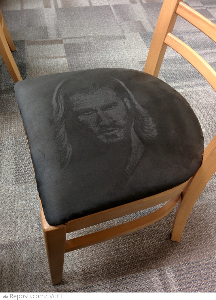 Thor's Face On A Suede Chair