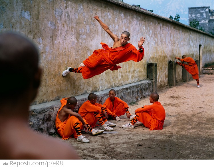 Monk running on a wall