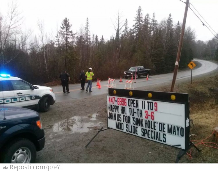 A sink hole opened up in front of a restaurant