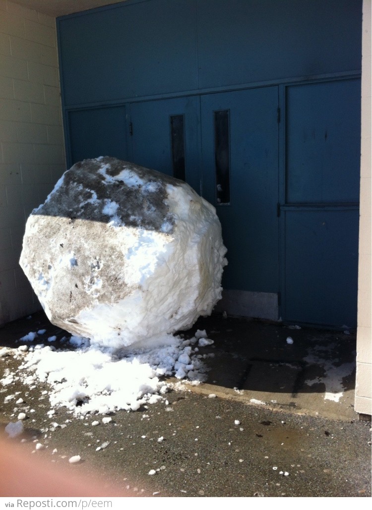 Someone rolled a giant snowball and blocked my school's door