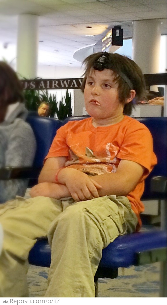 Why WOULDN'T you have a tiny Darth Vader strapped to your face at 6:00 AM in the airport?