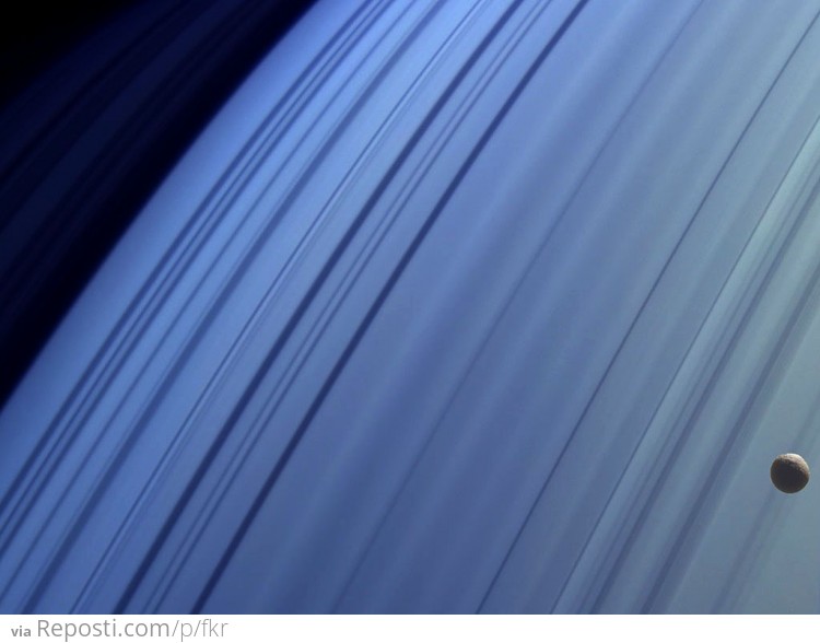 Saturn's moon Mimas drifting in front of its rings