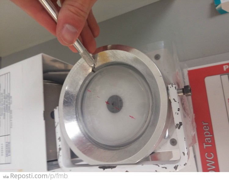After the lens is marked we use a machine to stretch the lens through some "surface saver tape"  its more like a screen protector for your smart phone.  It protects the plus side of the lens while we are going through the next few steps.