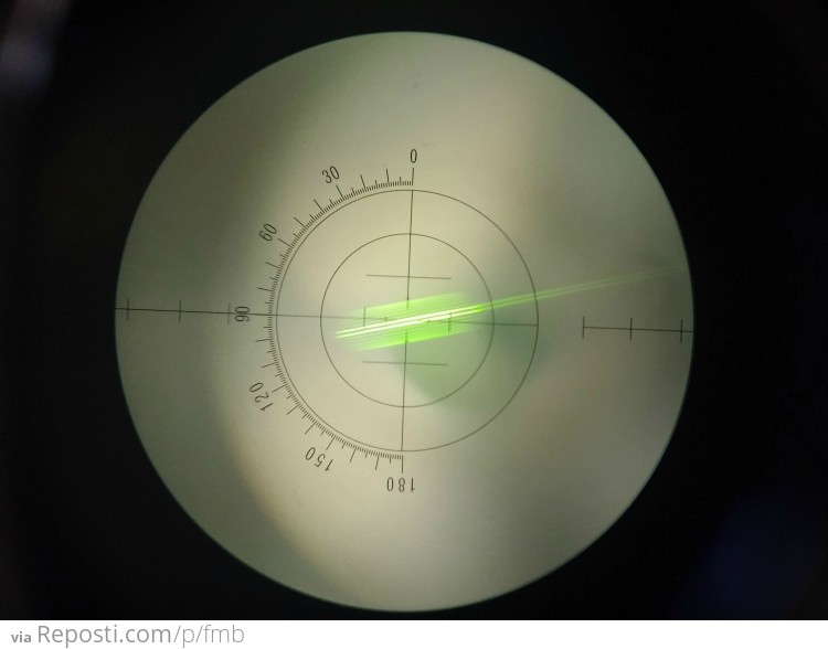 This is kinda hard to photograph so don't judge.  In the lensometer (which is used to check RX's after the process)  there are two sets of markings.  sphere marks (the 2 long ones) and the cylinder. (3 fatter ones)