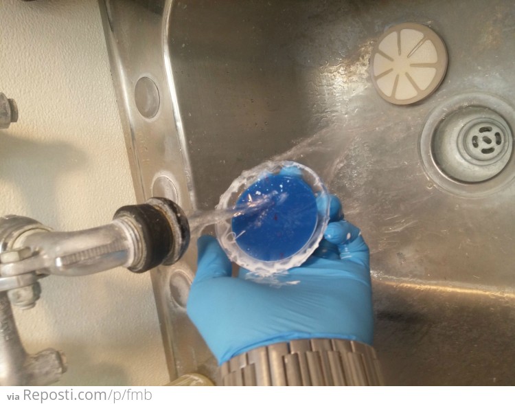 Rinse off all the polish in warm water which also loosens up the wax block.