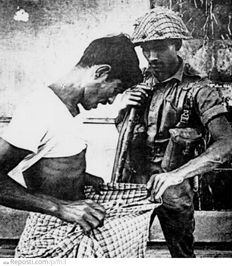 a Pakistani soldier during Bangladesh’s 1971 war of independence examines whether the man is circumcised or not(i.e. Hindus are not)