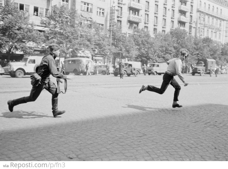The Prague Spring of 1968: Soviet soldier chasing young man who had thrown stones at a tank
