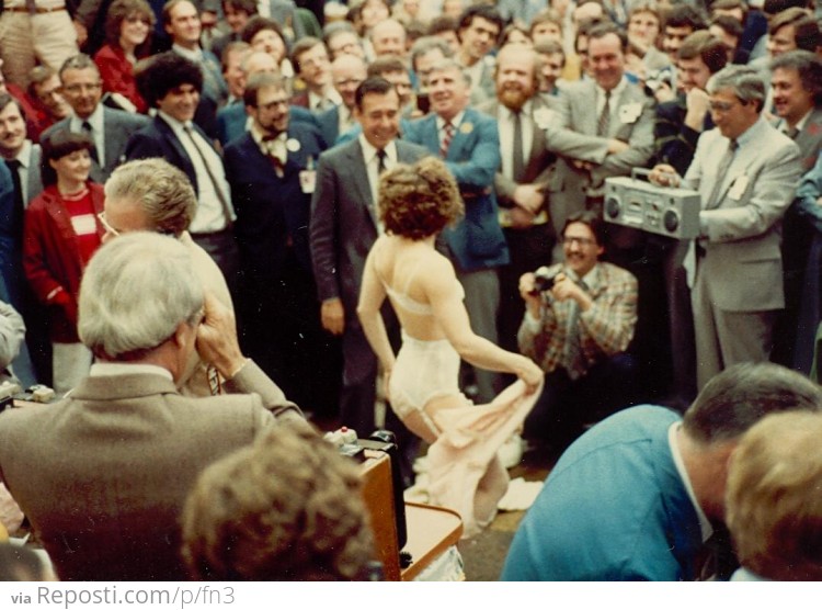 A stripper visits the trading floor of the Toronto Stock Exchange, late 1970s