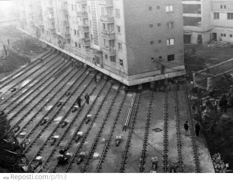 Moving a 7600 ton apartment building to create a boulevard in Alba Iulia, Romania, 1987