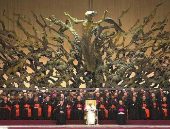 Just the Pope hanging out in front of a statue of Jesus...