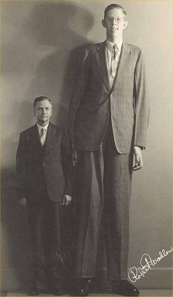 The tallest man to have ever lived, standing next to his father