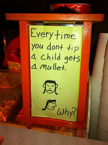 A sign in a pizza restaurant down 6th street, Austin, Texas