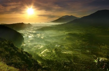 Spectacular sunrise over Batur Utara, Bali