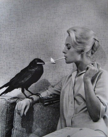 Woman getting a light from a crow