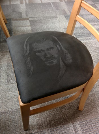 Thor's Face On A Suede Chair