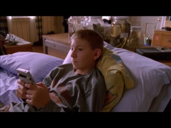 Dewy is playing a gameboy with no game in it