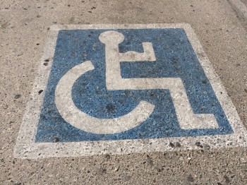 Handicap guy at the gym - flexing his muscles
