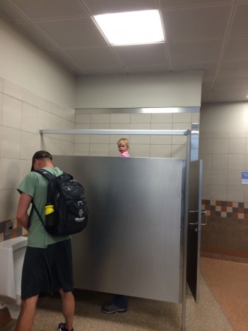 I just saw this tall guy with a really weird head in the bathroom