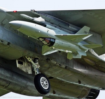 A Fighter Jet attached as a missile on a Fighter Jet
