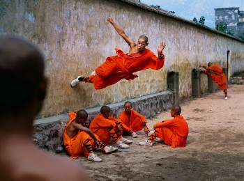 Monk running on a wall