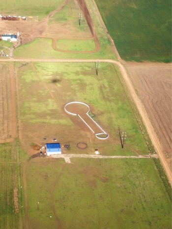 What do you suppose that farmer is growing?