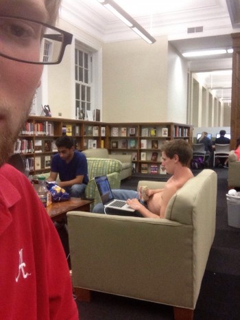 Studying for finals in the library, drinking beer and shirtless