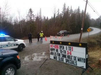 A sink hole opened up in front of a restaurant