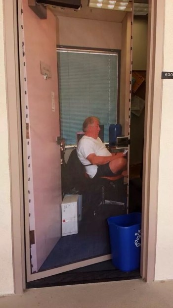 Professor is never in his office, so he put a giant poster of himself on the door