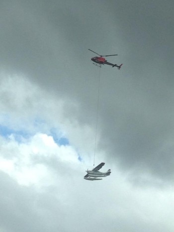 Helicopter carrying a plane