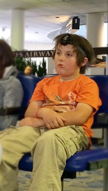 Why WOULDN'T you have a tiny Darth Vader strapped to your face at 6:00 AM in the airport?