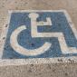 Handicap guy at the gym - flexing his muscles